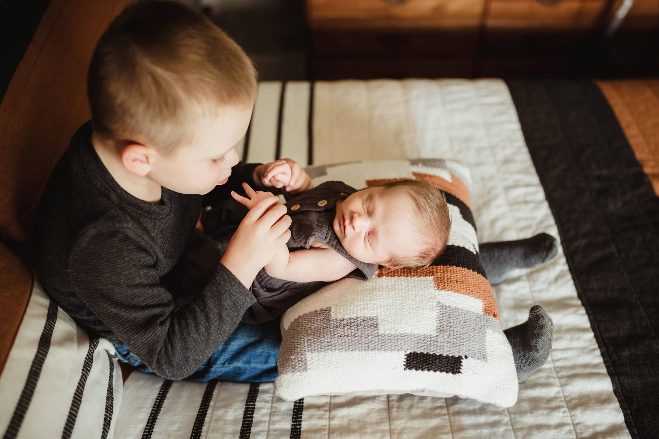 Doula St Louis little boy holding his newborn brother
